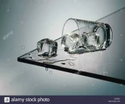 ss-tumbler-of-white-spirit-with-ice-spilled-X2R28C.webp