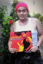 Rod Maceda holding his vinyl album cool smirk.webp Rod Maceda holding his vinyl album cool smirk.webp