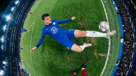 Football_Action_Image_In_a_fisheye_lens_style_a_male_soccer_player_in_bCRzofTN (1).webp