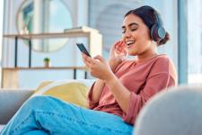 happy-woman-headphones-and-smartphone-in-living-room-on-social-media-app-audiobook-or-radio.jpg happy-woman-headphones-and-smartphone-in-living-room-on-social-media-app-audiobook-or-radio.jpg