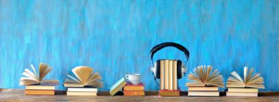 audio-book-concept-with-open-books-cup-of-coffee-and-vintage-headphones-panoramic-good-copy.jpg