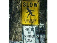 funny-road-signs-children-hunting.webp