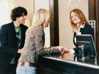 8-more-hotel-desk-clerk-secrets-01-checking-in-sl.webp