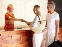 -more-hotel-desk-clerk-secrets-04-shaking-hands-sl.webp